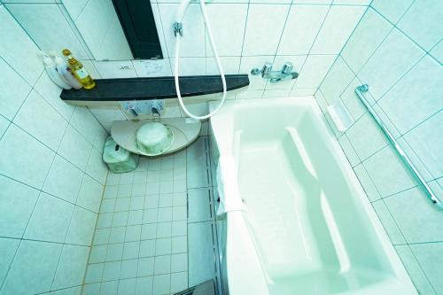 a bathroom with a toilet and a sink and a tub at Hashima - Hotel - Vacation STAY 52664v in Hashima