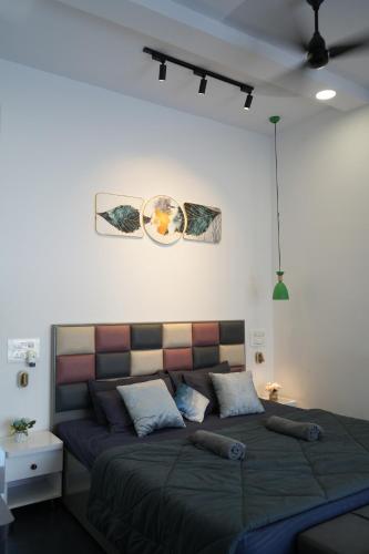 a bedroom with a large bed in a room at Casa Oceanus - Pool Facing Room - Ganpatipule in Nevra