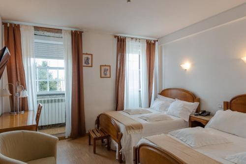 Postel nebo postele na pokoji v ubytování Hotel Santos