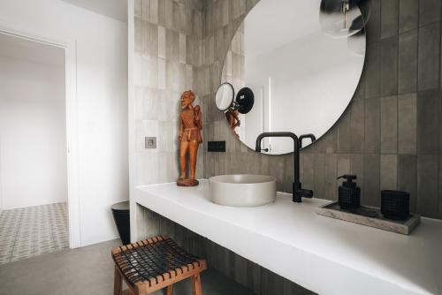 a bathroom with a sink and a mirror at Finca Marisa in Tinajo