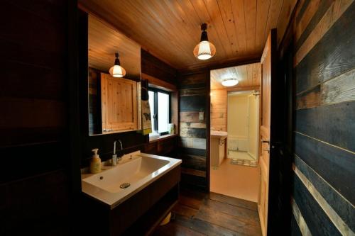 a bathroom with a sink and a mirror at Cominka - Vacation STAY 30137v in Chino