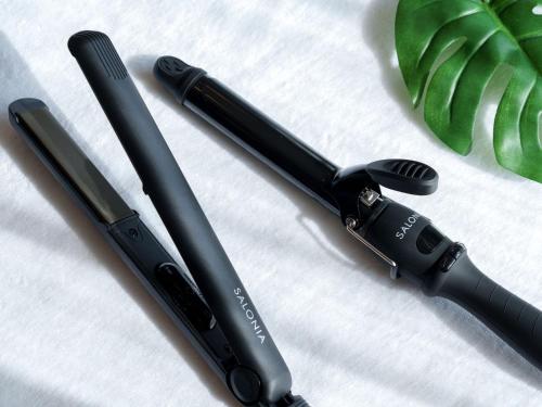 two black pens sitting on top of a bed at Dotonbori Crystal Hotel - Vacation STAY 77453v in Osaka