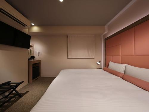 a bedroom with a large bed in a room at Dotonbori Crystal Hotel - Vacation STAY 77453v in Osaka