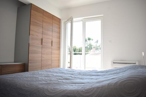 Postel nebo postele na pokoji v ubytování Luxury Apartments Adria