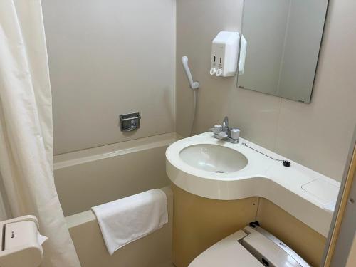 a small bathroom with a sink and a toilet at Hotel Yamadaso - Vacation STAY 41353v in Nago