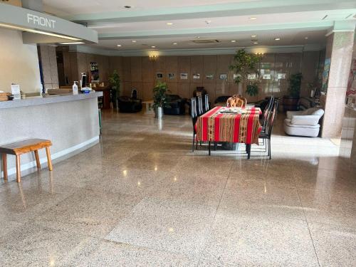 a dining room with a table and chairs in a building at Hotel Yamadaso - Vacation STAY 41344v in Nago