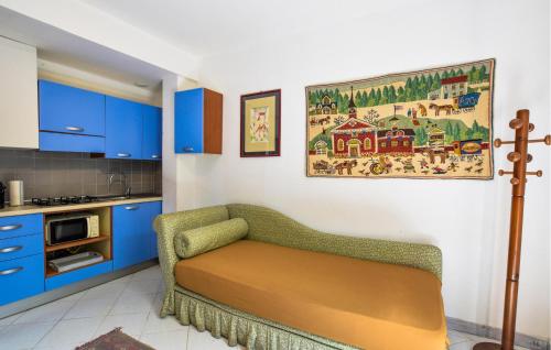 a kitchen with a couch in the corner of a room at Rasara in Arquà Petrarca