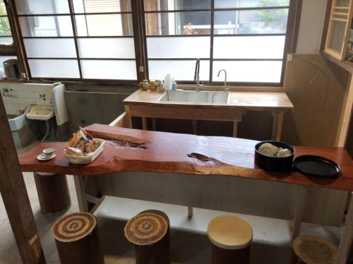 a kitchen with a sink and a wooden counter top at Setouchi base - Vacation STAY 48143v in Mitoyo