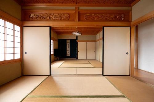 an empty hallway with doors in a building at Setouchi base - Vacation STAY 47136v in Mitoyo