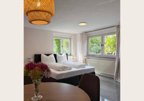 a living room with a couch and a table at hortensiengarten in Teningen