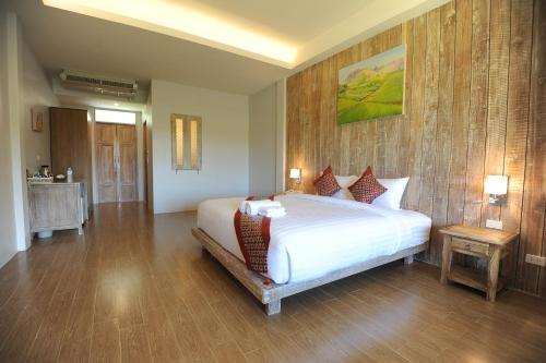 Ένα ή περισσότερα κρεβάτια σε δωμάτιο στο NanSripanna resort