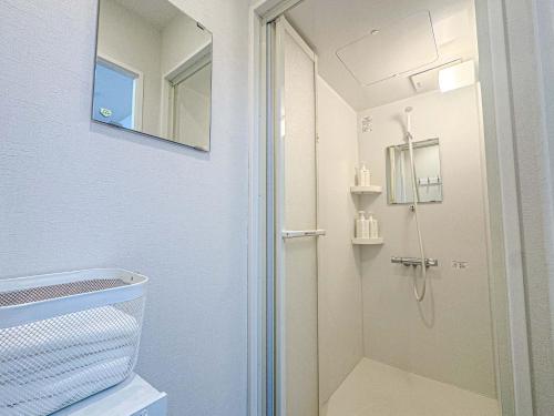 a bathroom with a shower and a mirror at D Hotel - Vacation STAY 14103v in Tokyo