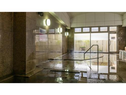 an empty room with water on the floor at Hotel Symphony - Vacation STAY 85392v in Sagae