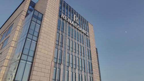 a building with a sign on the side of it at Renaissance Xi'an Hotel in Xi'an