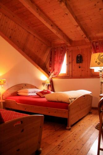 a bedroom with a large bed in a room at Garni Biancaneve Ruffrè-Mendola in Mendola