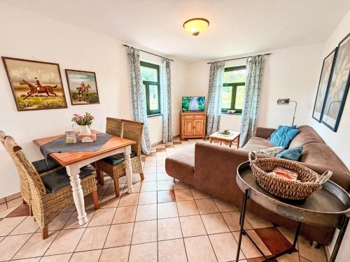 a living room with a couch and a table at Apartment Bornholm by Interhome in Dargun