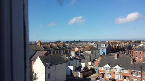 a view of a city with houses and buildings at Molyneux Guesthouse in Weymouth