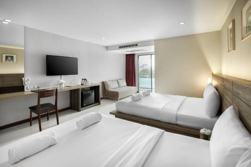 Llit o llits en una habitació de Diamond Residence Ratchada