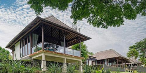 a rendering of a house with a roof at Moksha Wellness Bali in Plaga