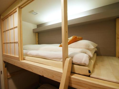 a couple of bunk beds in a room at Guesthouse Nara Komachi in Nara