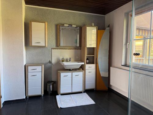 a bathroom with a sink and a mirror at Apartment Florence in Wettringen