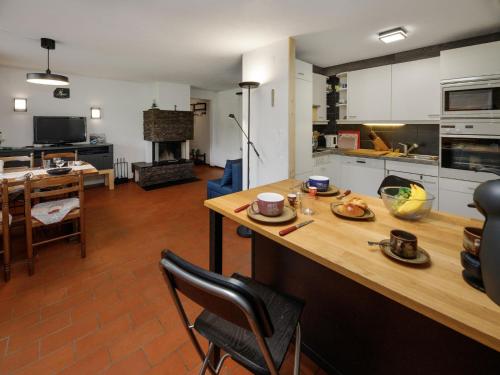 a kitchen with a wooden counter top in a room at Apartment Chalet l'Aube by Interhome in Vers L'Eglise