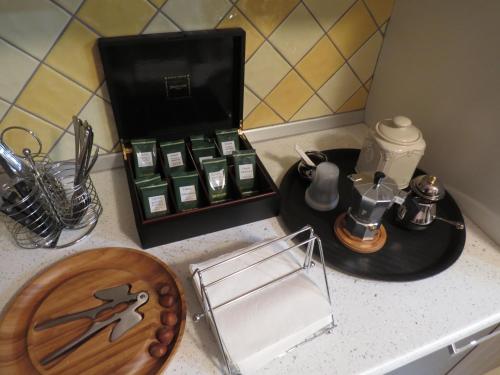 a kitchen counter with a counter top with a tray of spices at B&B La Maison in Potenza