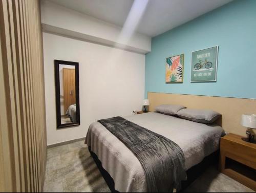 เตียงในห้องที่ Apartamento Céntrico PB diagonal al CC La Vela