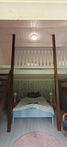 a bedroom with a bed in a room at Raju - Guest House in Seinäjoki