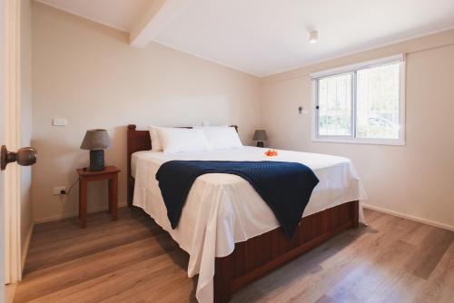 a bedroom with a large bed and a window at Suva Point Ocean Front Nukulau Island Views in Suva