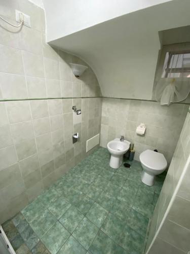 a bathroom with a toilet and a bidet at MareLuna in Gaeta
