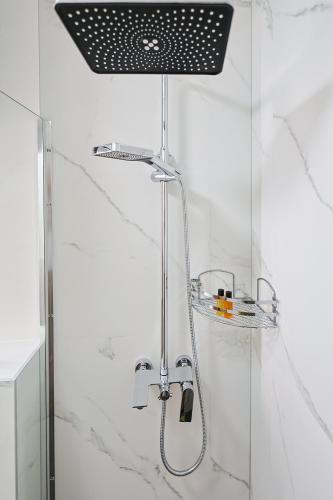 a shower with a glass door in a bathroom at FourMountains-Igman in Sarajevo
