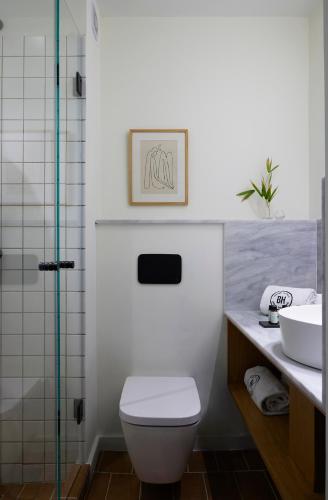a bathroom with a toilet and a sink at Brown Beach Evia Island, All Inclusive in Eretria, a member of Brown Hotels in Eretria