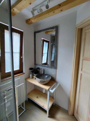 a bathroom with a sink and a mirror at Borówkowa Dolina in Lądek-Zdrój
