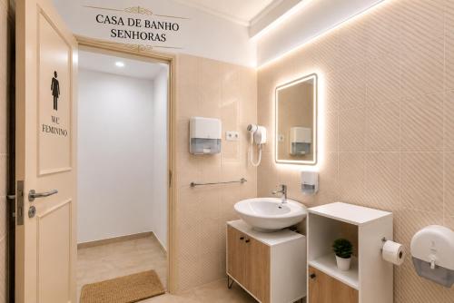 a bathroom with a sink and a mirror at Rooms4you 3 in historic center of Braga in Braga