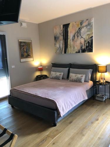 a bedroom with a large bed with two pillows at ML32 in Ravenna