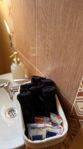 a basket of toothpaste sitting next to a sink at Сонита in Yamna