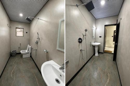 a bathroom with a sink and a toilet and a sink at Baga beach heritage resort in Calangute