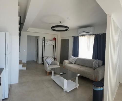 a living room with a couch and a table at Aera Villas - Kaş in Kaş