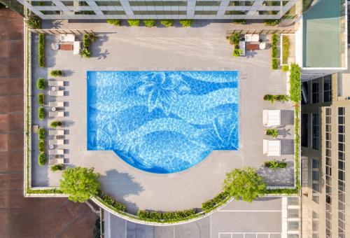 an overhead view of a swimming pool in a building at Canton Hotel Guangzhou, Tapestry Collection By Hilton in Guangzhou