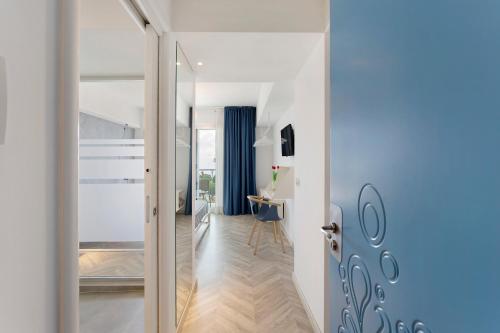 a hallway with a door leading to a living room at Haddar Etna in Zafferana Etnea
