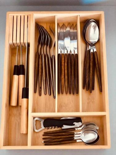 a wooden box filled with lots of utensils at Paraísos de Agaete in Puerto de las Nieves