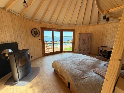 a bedroom with a bed and a view of the ocean at Forest Marina 