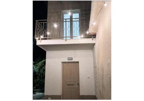 a small building with a door and a balcony at Dimora Tra Mare e Montagna in Lanciano