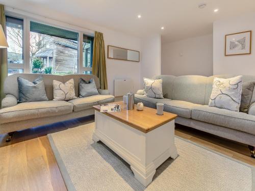 a living room with two couches and a coffee table at Lodge 74 Una in Carbis Bay