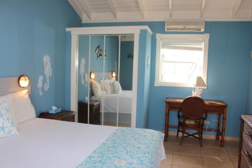 Postel nebo postele na pokoji v ubytování Hideaways Exuma