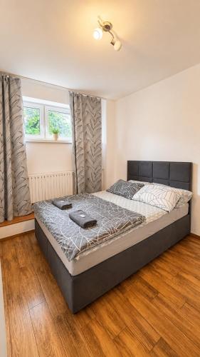 a bedroom with a large bed in a room at Apartament Bielsko in Bielsko-Biała