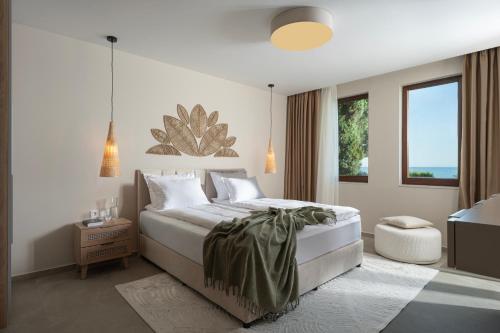 a bedroom with a large bed and a window at Casa Real in Sveti Vlas