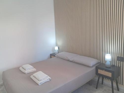 a bedroom with a bed with two towels on it at Centric 2 bedrooms Apartment near to the beach - newly renovated bathroom and bedrooms - by TENERIFEHINTS in El Médano