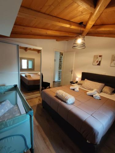 a bedroom with a large bed in a room at Alvesta Guest House in Nafplio